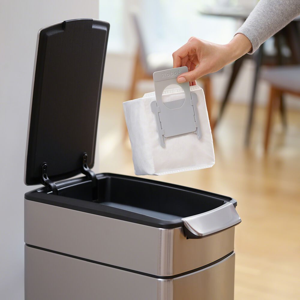Automatically empties its bin on its own with enclosed bag system